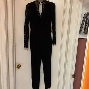 Black lace top jumpsuit.New size Small.